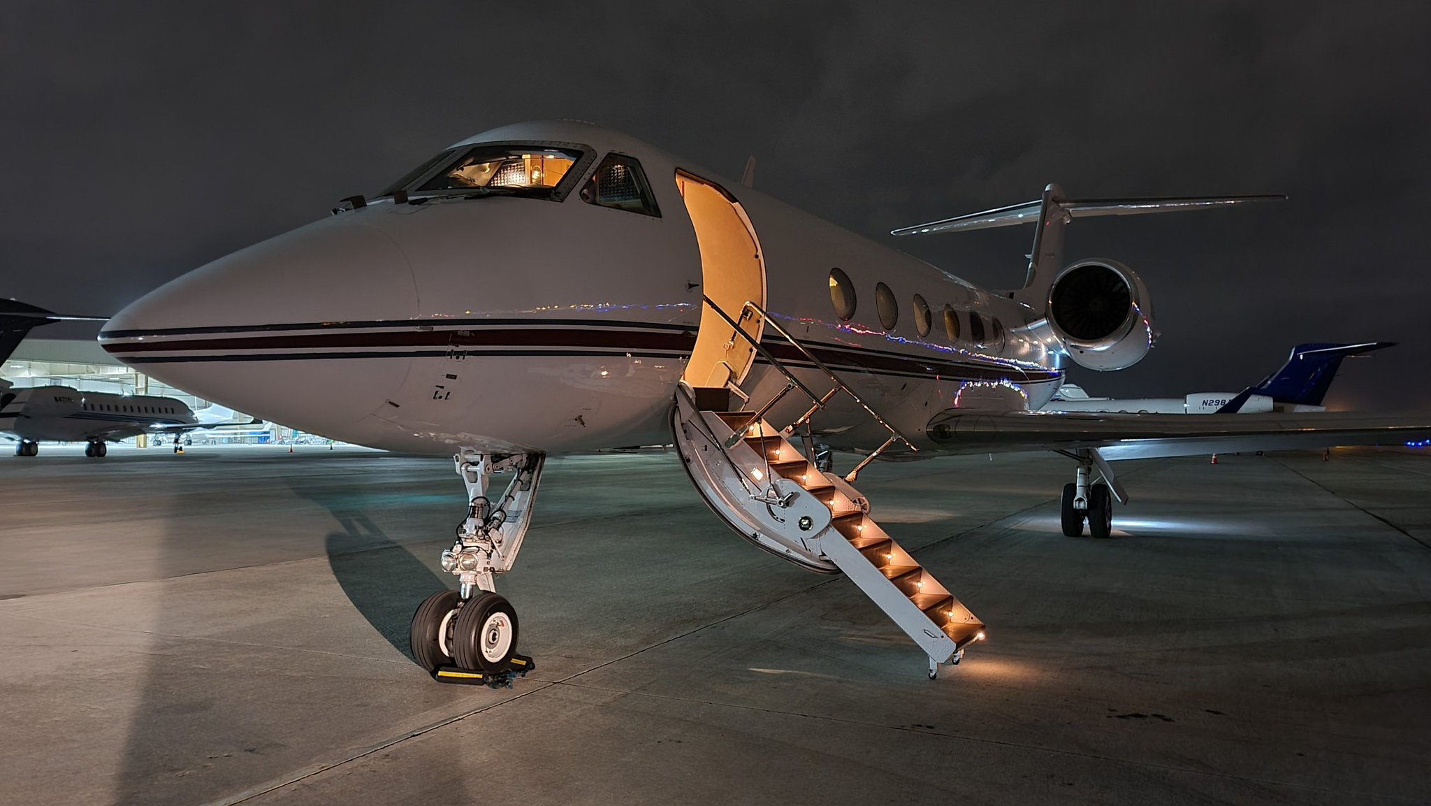 Business aircraft parked on an airport ramp